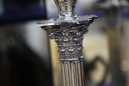 A late Victorian silver corinthian column oil lamp by Walker & Hall, overall height 87cm.